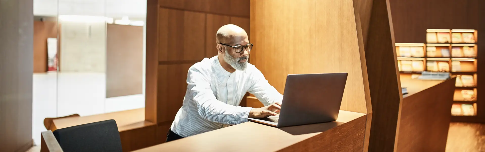 mature man working on laptop at workspace in libra 2024 09 19 04 29 49 utc